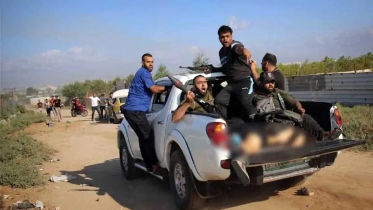 Associated Press wins award for photo of dead woman with Hamas militants.